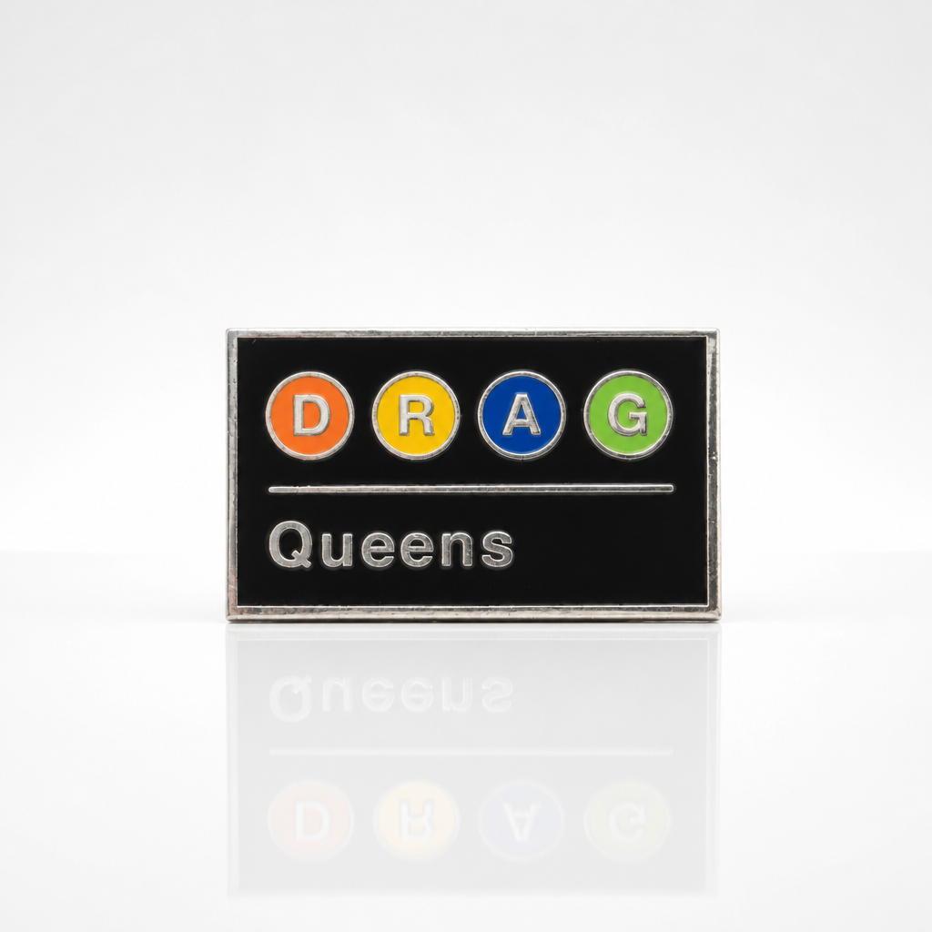 Drag Queens Subway enamel pin featuring colorful transit-style lettering on a black background