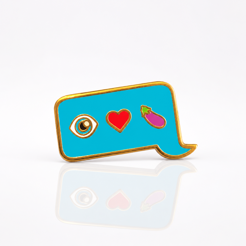 Eye Heart Eggplant enamel pin featuring eye, heart, and eggplant emojis inside a blue speech bubble