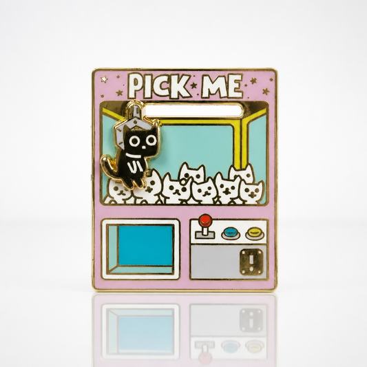 Interactive Pick Me Claw Machine deluxe enamel pin featuring a movable black cat inside a colorful arcade claw machine