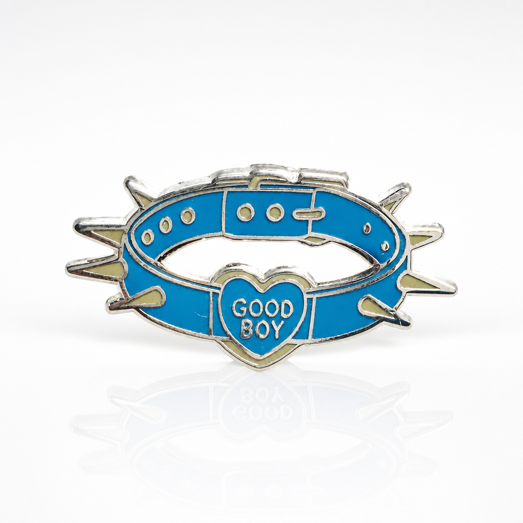 Good Boy Collar enamel pin featuring a blue spiked collar with a heart-shaped charm