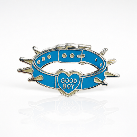 Good Boy Collar enamel pin featuring a blue spiked collar with a heart-shaped charm