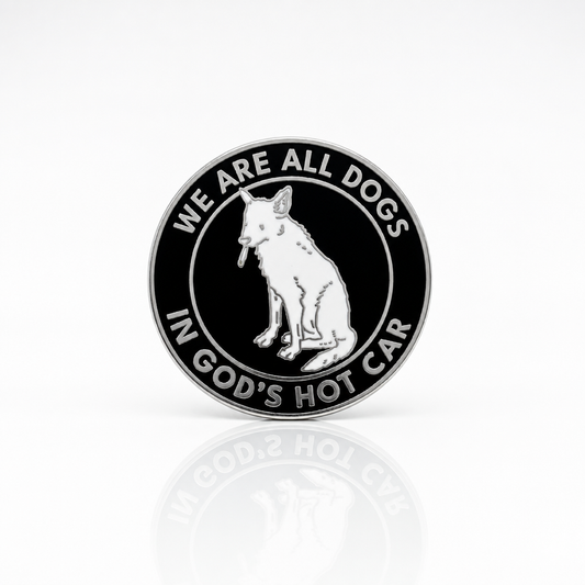 Black and silver hard enamel pin featuring a dog illustration and the phrase We Are All Dogs in God's Hot Car