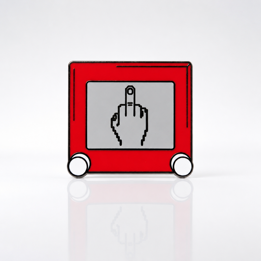 Premium hard enamel pin styled like a classic retro sketch toy featuring a humorous pixel-style drawing on the screen with black metal plating.