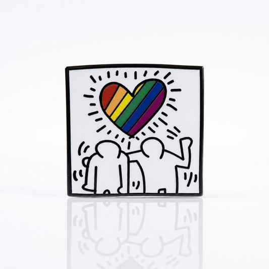 Pop art inspired enamel pin featuring abstract figures beneath a rainbow heart