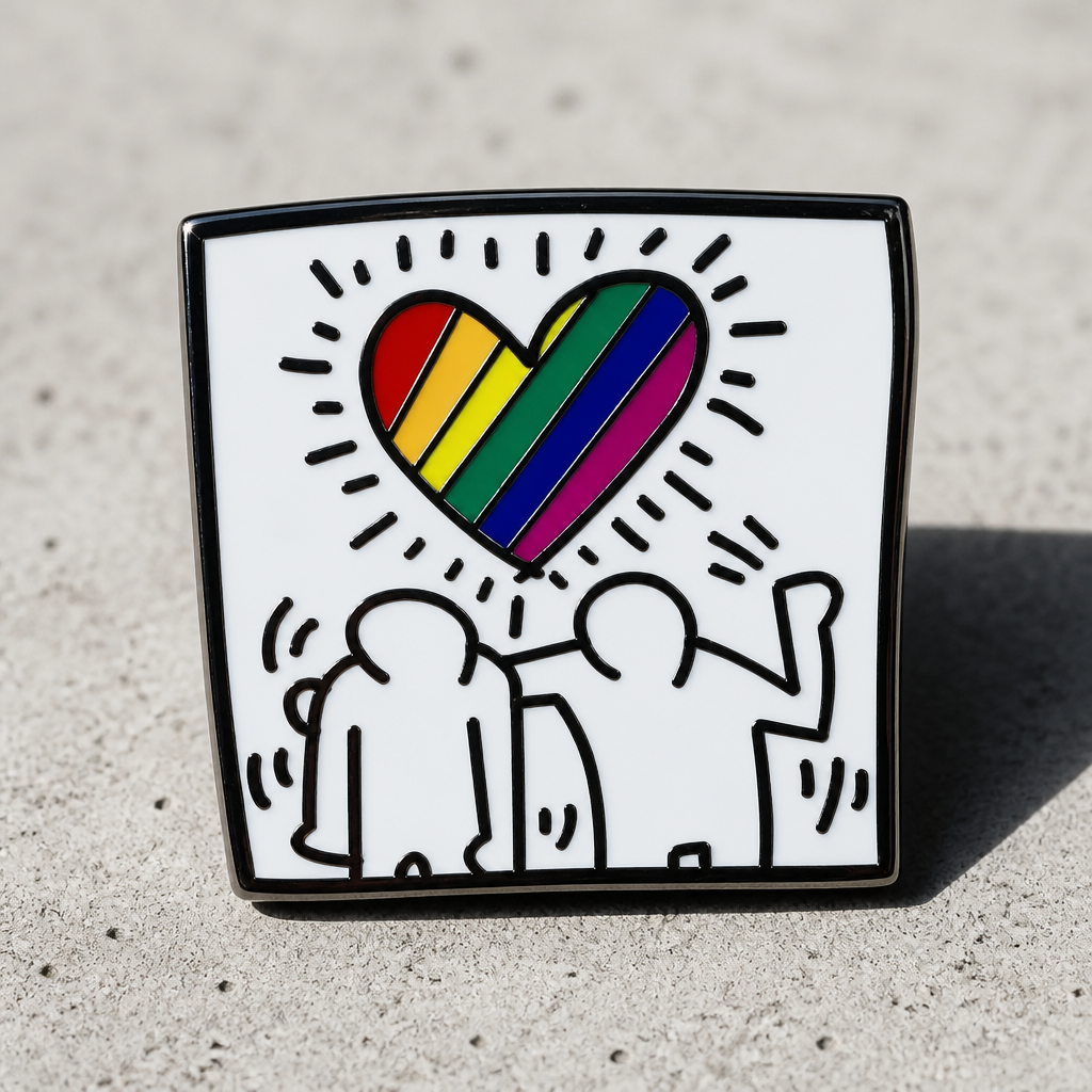 Pop art inspired enamel pin featuring abstract figures beneath a rainbow heart on a concrete surface