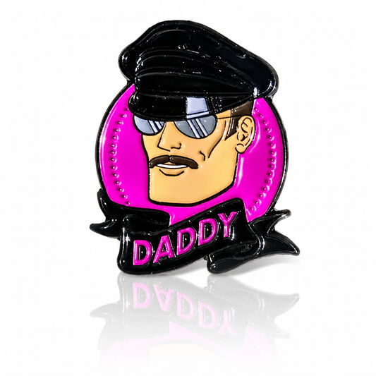 Hard enamel Daddy pin featuring a leather-inspired character wearing sunglasses against a bright pink background.