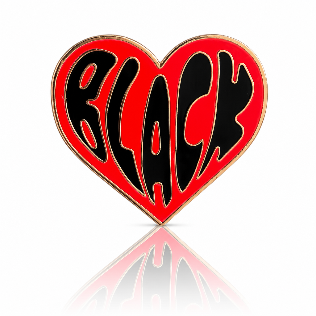 Black Love heart-shaped hard enamel pin by Rebellious Pins with shiny gold plating and bold red lettering celebrating Black love and community.