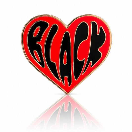 Black Love heart-shaped hard enamel pin by Rebellious Pins with shiny gold plating and bold red lettering celebrating Black love and community.