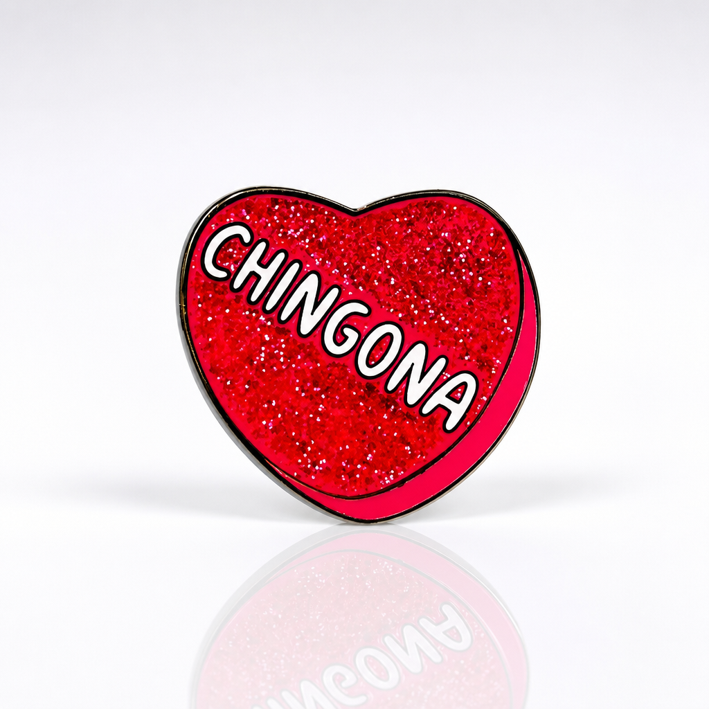 Pink glitter heart enamel pin with Chingona text design