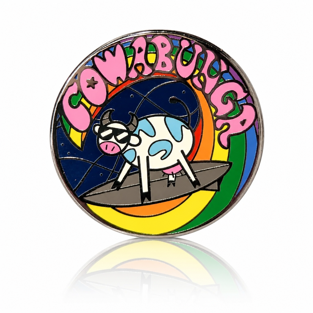 Cowabunga Pride enamel pin with sunglasses-wearing cow surfing on a rainbow wave