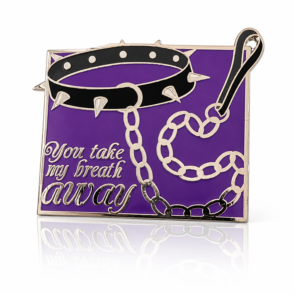 You Take My Breath Away enamel pin with black spiked choker and chain on purple background
