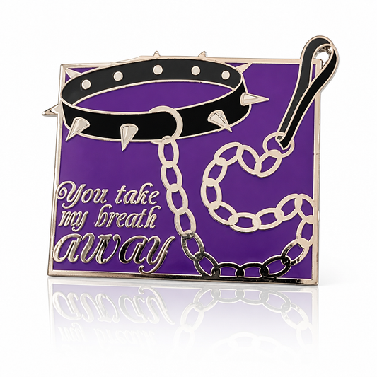 You Take My Breath Away enamel pin with black spiked choker and chain on purple background