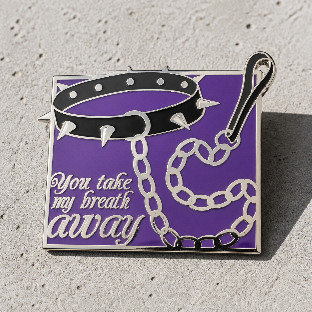 You Take My Breath Away enamel pin with black spiked choker and chain on purple background displayed on a concrete surface