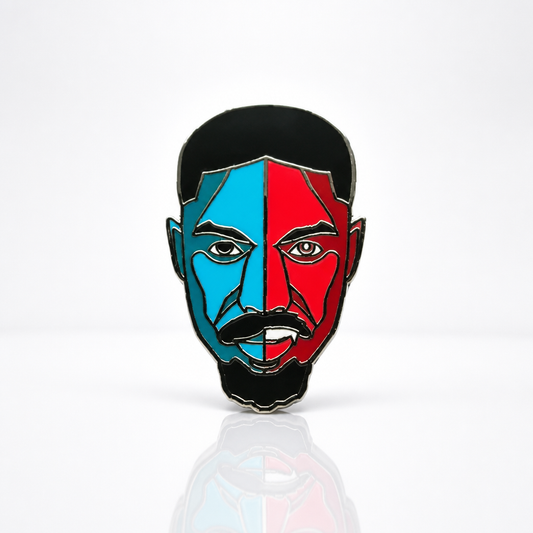Hard enamel pin featuring a stylized portrait inspired by Smoke from the film Sinners with bold red and blue artwork and silver-plated details