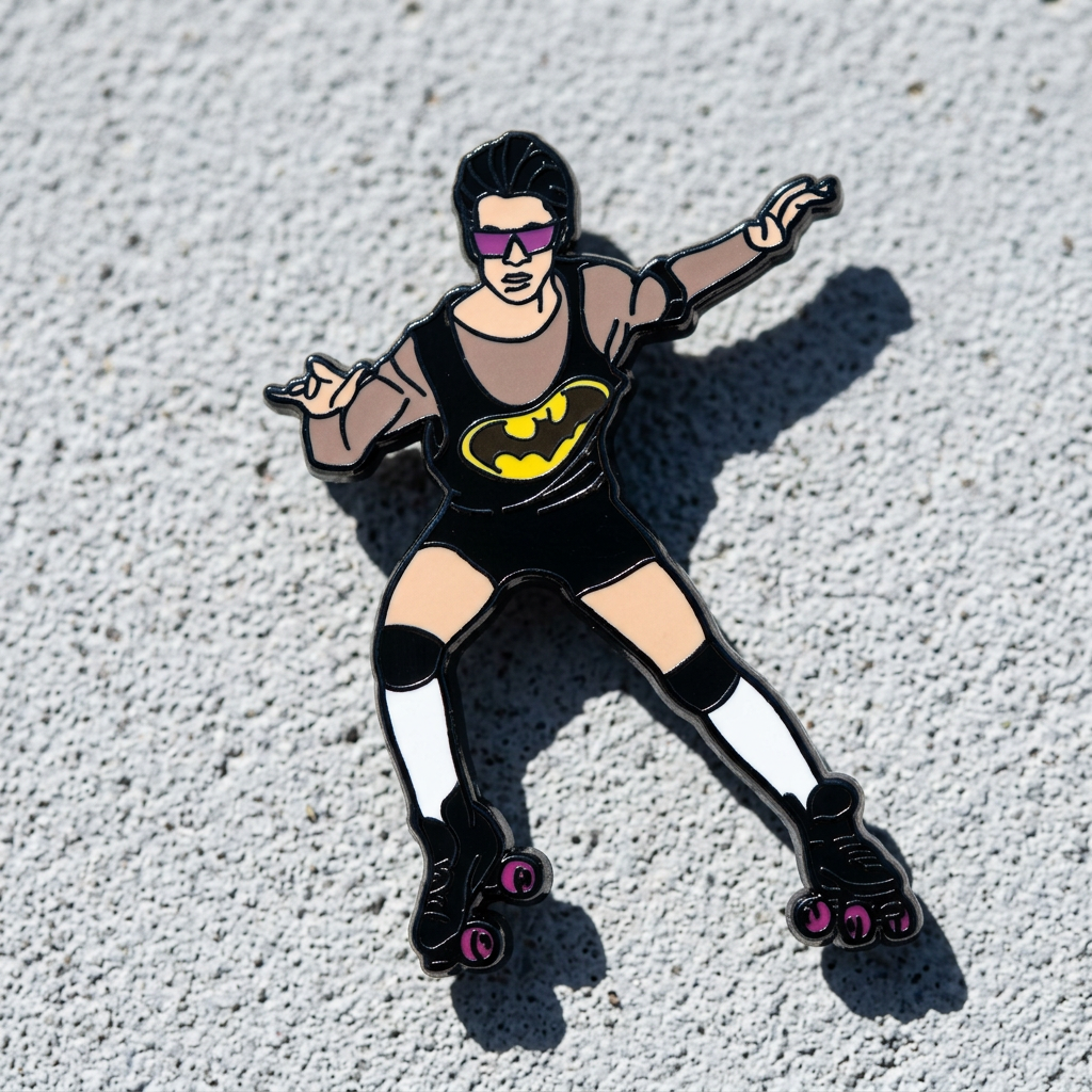 Hard enamel pin featuring a retro roller skater wearing sunglasses and a black outfit with roller skates in a playful disco-inspired design on a concrete surface