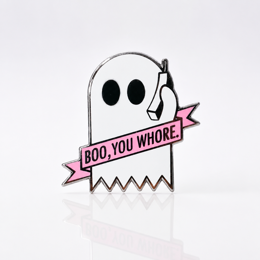 Hard enamel pin featuring a white ghost holding a phone with a pink banner reading Boo You Whore