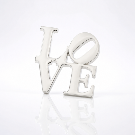 Silver plated LOVE pin inspired by the iconic Robert Indiana artwork featuring the tilted O design