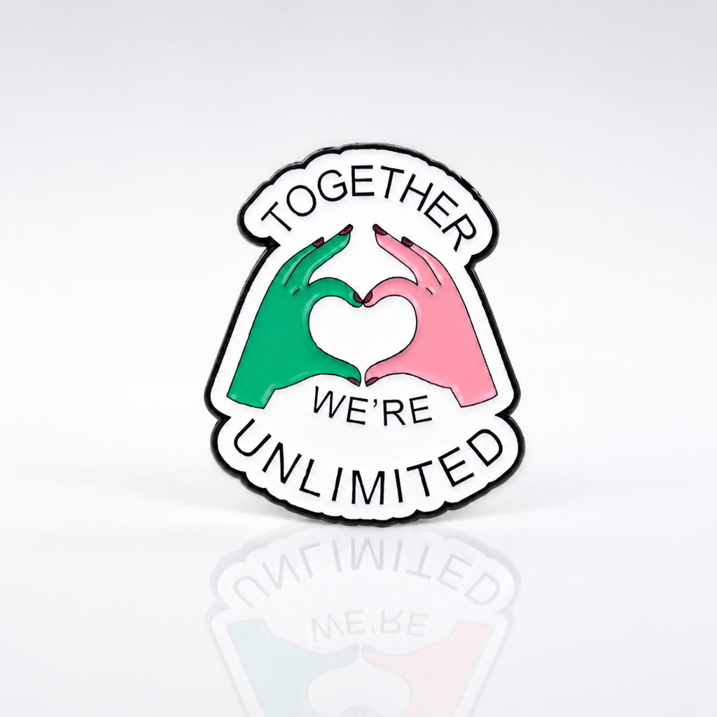 Together We’re Unlimited enamel pin with pink and green hand heart design inspired by musical theater fandom