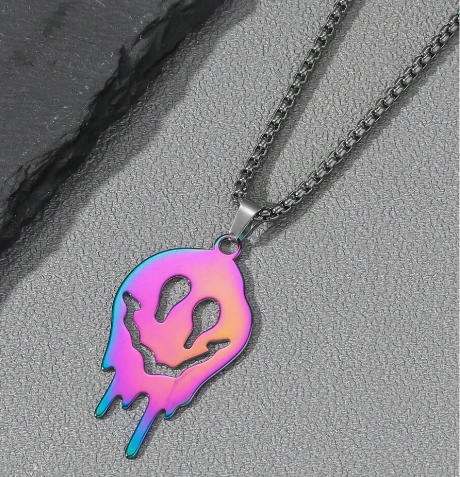 Iridescent rainbow ghost pendant necklace with colorful metallic finish on dark chain