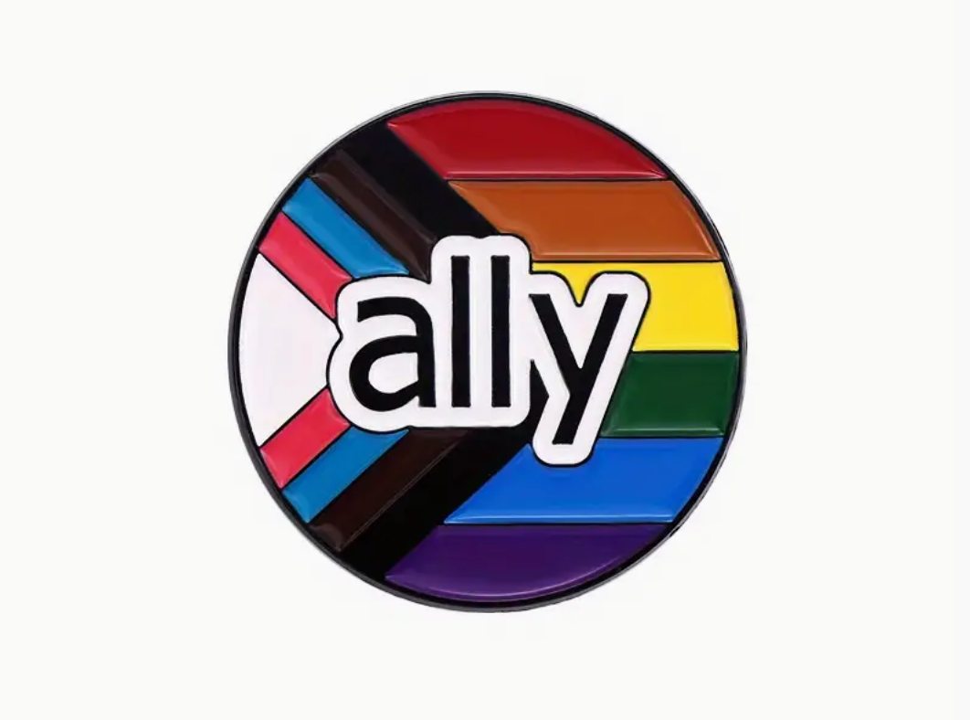 Round Progress Pride enamel pin with “ally” text and rainbow colors