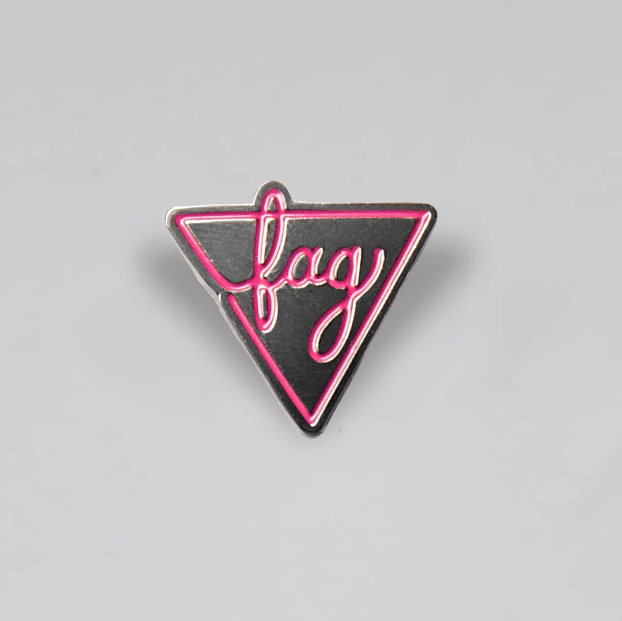 Black and pink Fag enamel pin featuring a bold geometric pride-inspired design