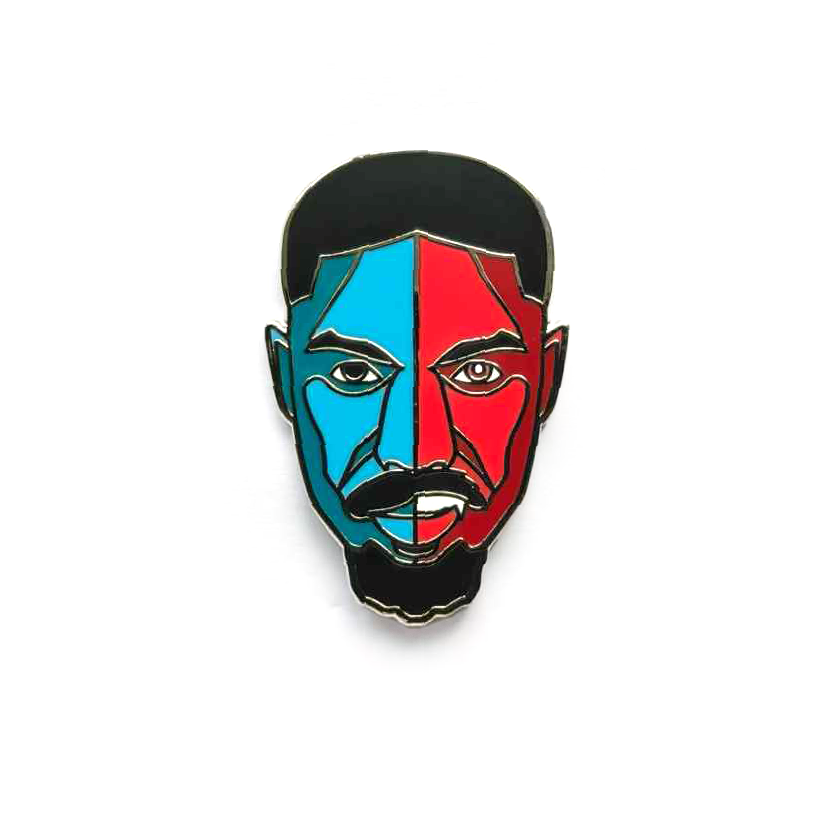 Hard enamel pin featuring a stylized portrait inspired by Smoke from the film Sinners with bold red and blue artwork and silver-plated details