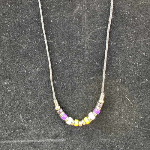 Nonbinary pride ceramic bead choker necklace with yellow white purple and black beads on black cord