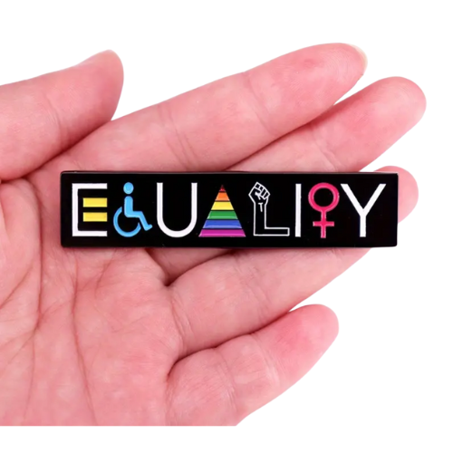 Hand holding a Large Equality Pride enamel pin featuring inclusive LGBTQ symbols and rainbow colors