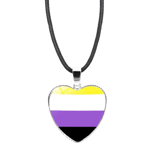 Nonbinary pride heart pendant necklace with yellow white purple and black flag colors beneath glass heart charm
