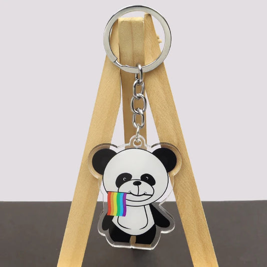 Cute panda acrylic keychain holding LGBTQ rainbow pride flag