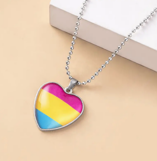 Pansexual pride heart pendant necklace with pink yellow and blue flag colors beneath glass heart charm