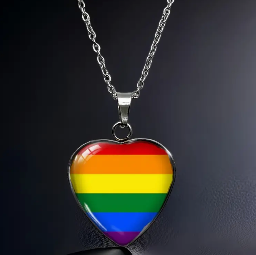 Rainbow pride heart pendant necklace with LGBTQ rainbow colors beneath glass heart charm