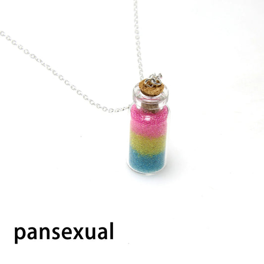 Pansexual pride bottle necklace with layered pink yellow and blue micro-beads inside glass vial pendant