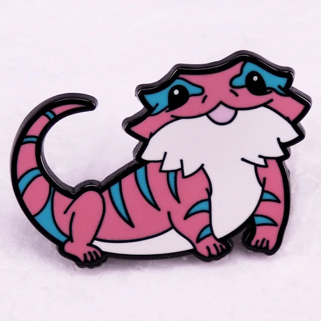 Cute bearded dragon enamel pin featuring Trans Pride flag colors