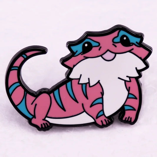 Cute bearded dragon enamel pin featuring Trans Pride flag colors